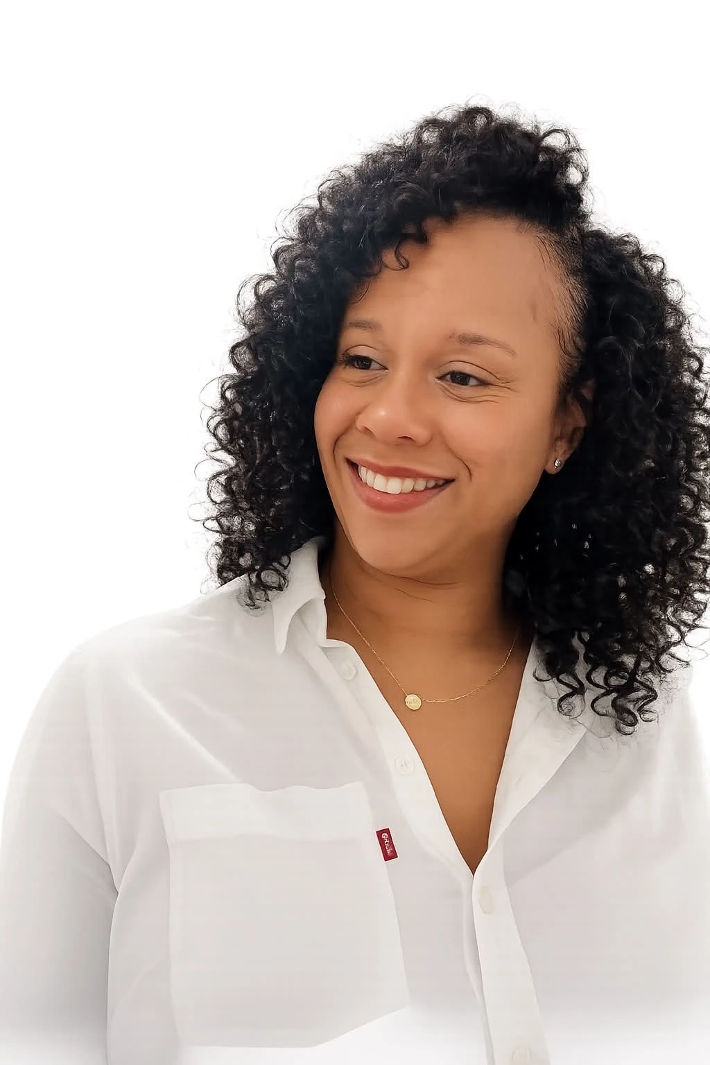 Tamesha McRae smiling in a white blouse